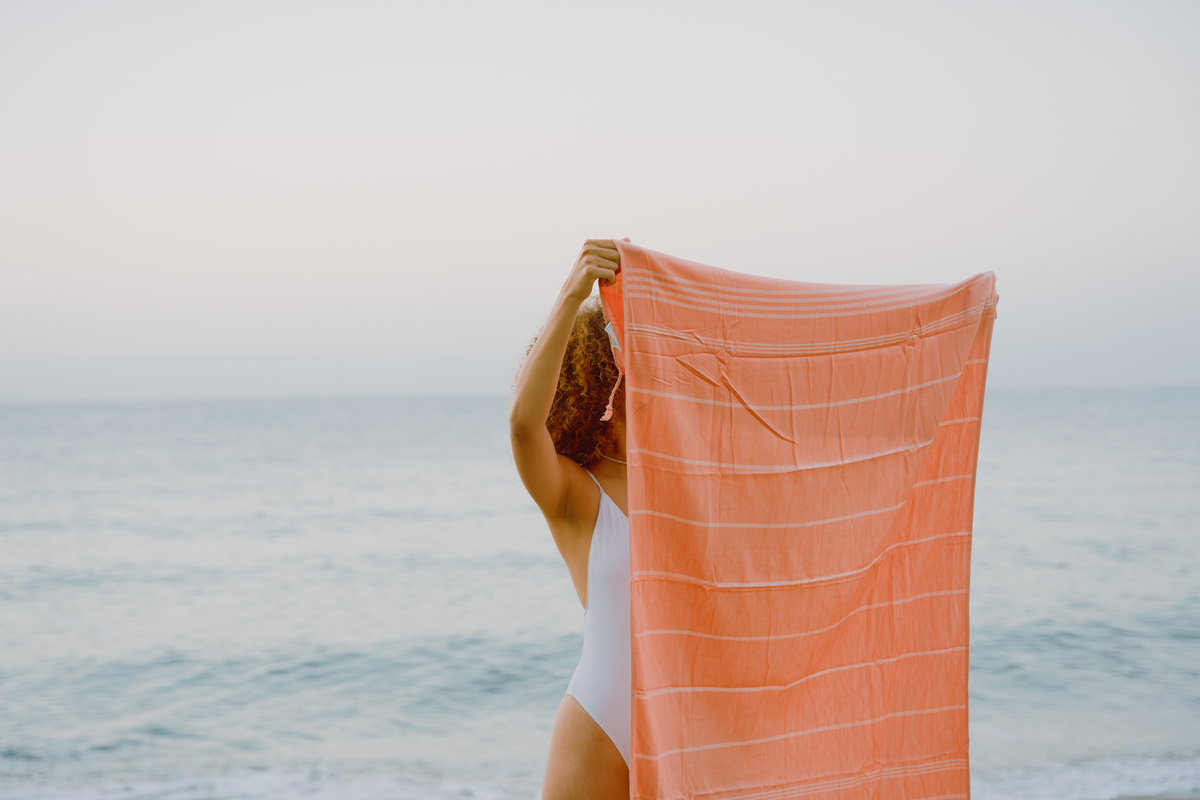 Beach Expedition Woman Holding a Beach Towel